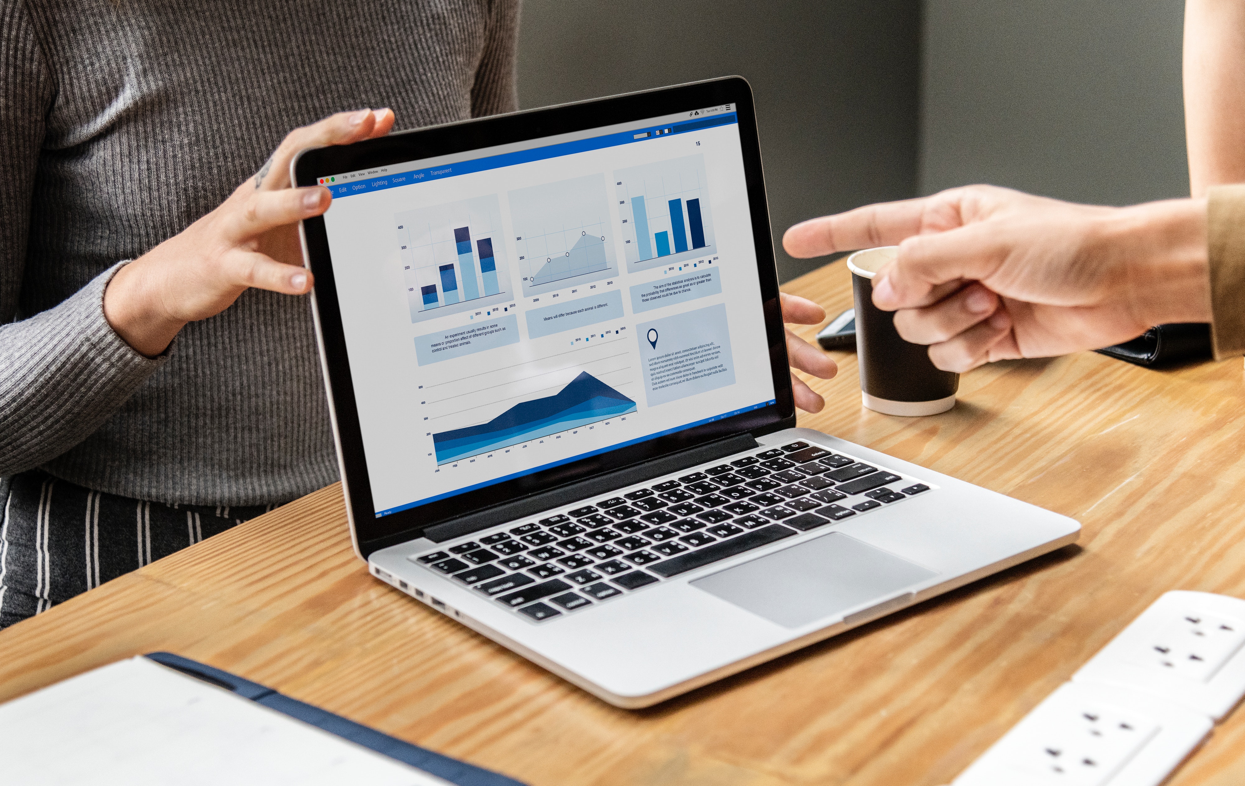 A laptop displaying analytics and graphs, an example of one of the analytical property management marketing solutions offered by Fourandhalf A laptop displaying analytics and graphs, an example of one of the analytical property management marketing solutions offered by Fourandhalf