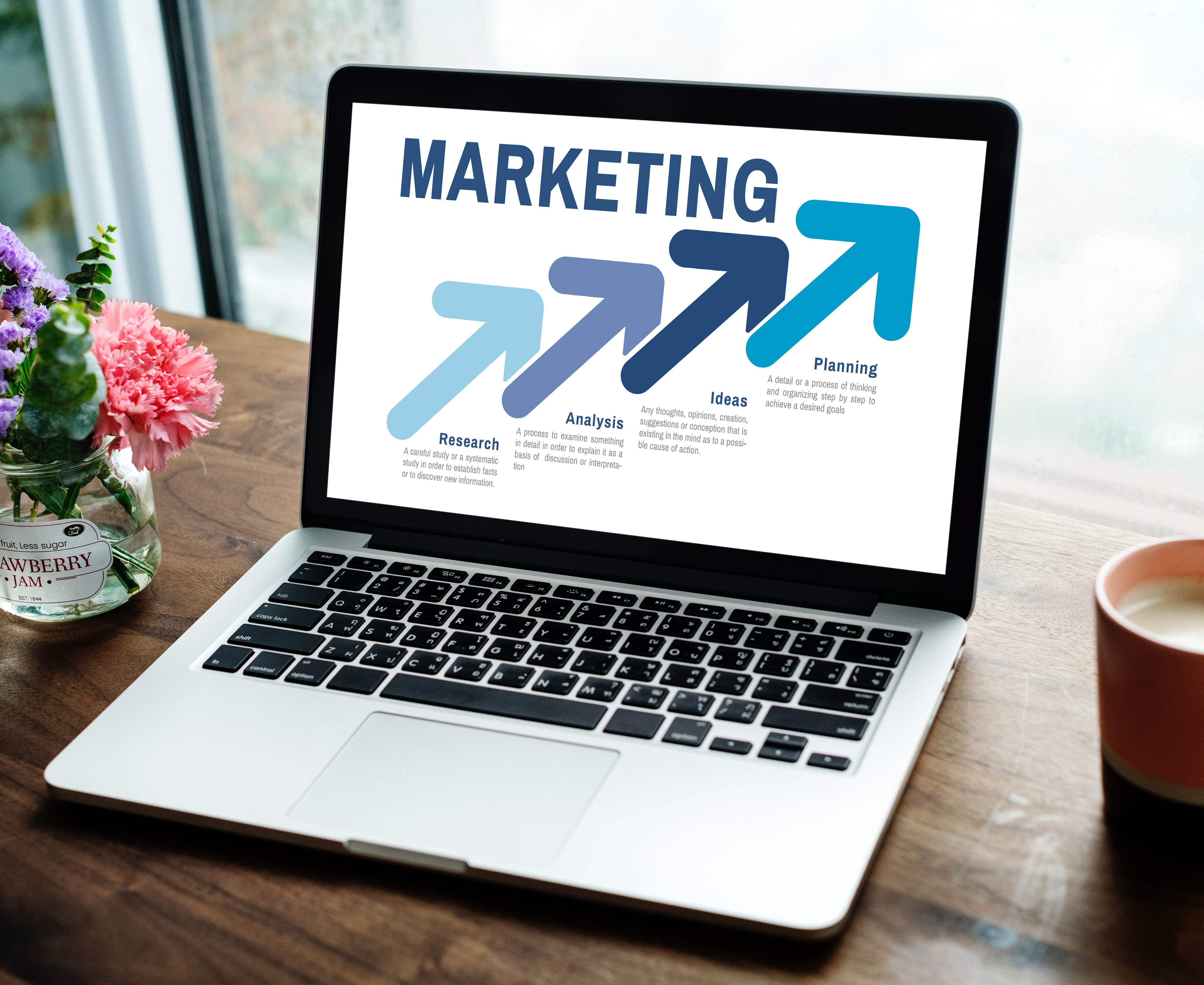 A laptop showing different aspect of marketing, representative of Fourandhalf's property management marketing services A laptop showing different aspect of marketing, representative of Fourandhalf's property management marketing services