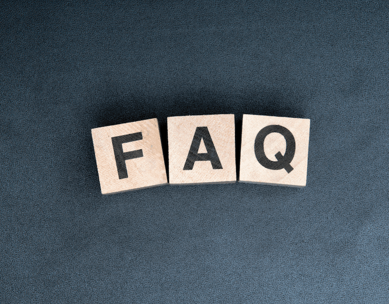 Small wooden blocks spell out FAQ