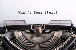 Typewriter below the words 'What's your Story?'
